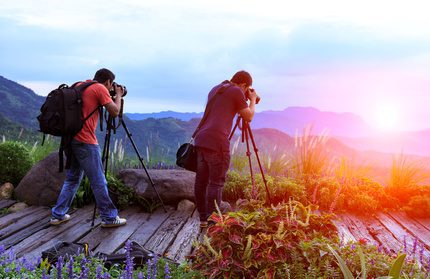 Nature photographer taking photos in the mountains