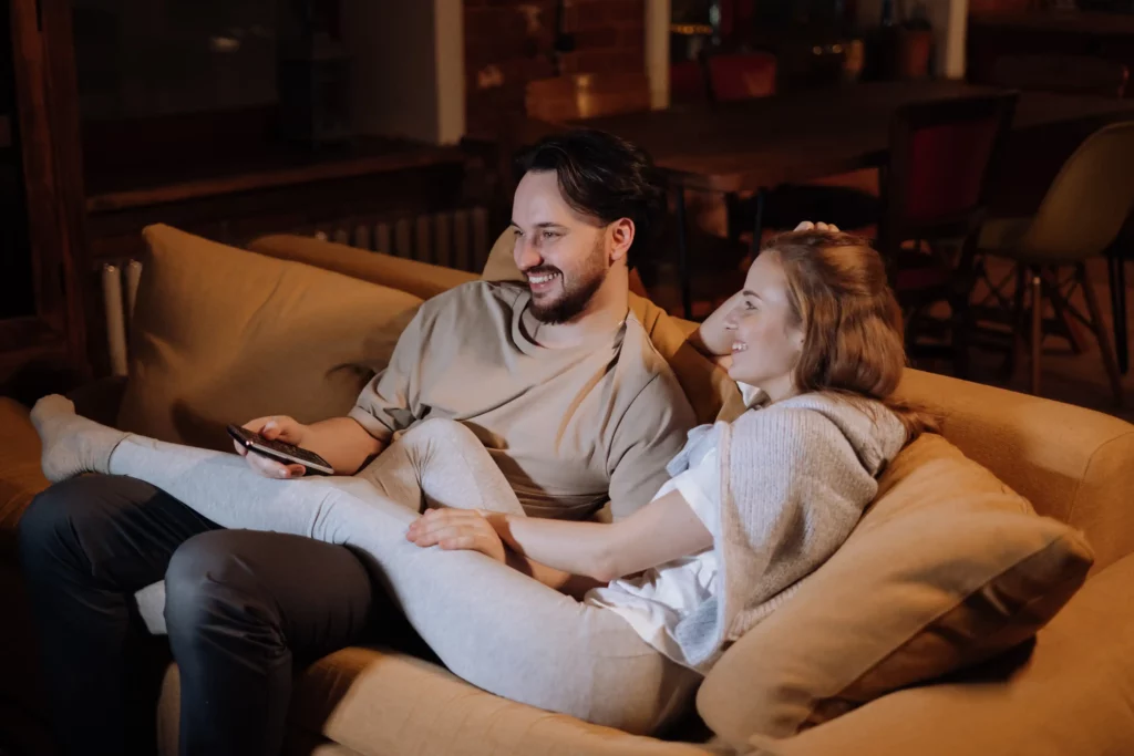 couple watching a movie on the couch